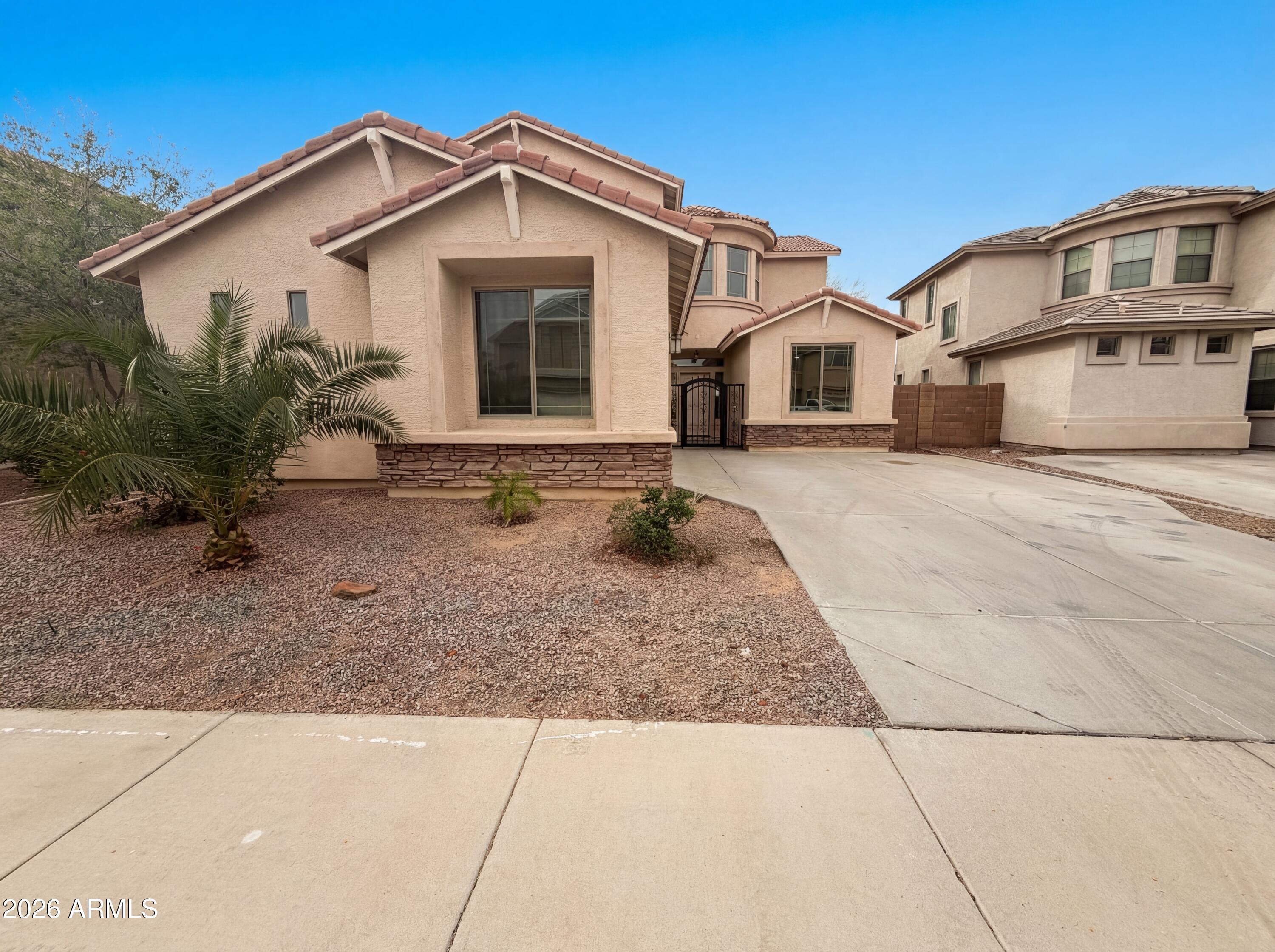 25703 W CROWN KING Road, Buckeye, AZ 85326 — Photo 1 of 23